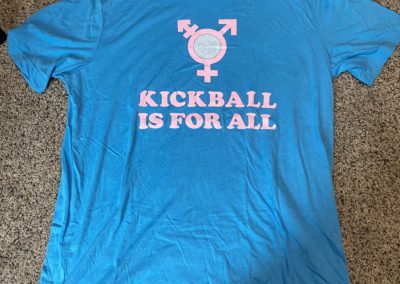 Blue t-shirt with words "Kickball is for all"