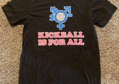 Black t-shirt with words "Kickball is for all"